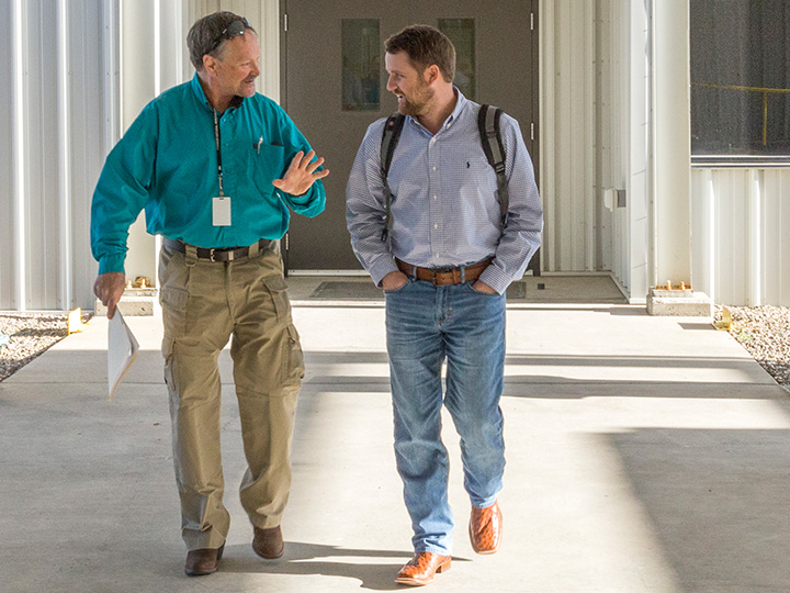 Two Men Walking and Talking